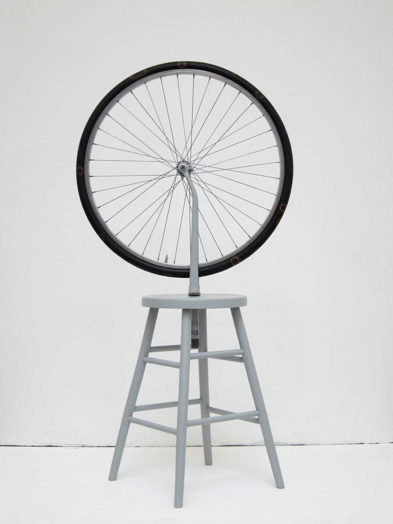 Bicycle Tube, 2016 | bicycle wheel and fork, air chamber, patch, wooden stool, paint | cm. 130 x 64 x 42