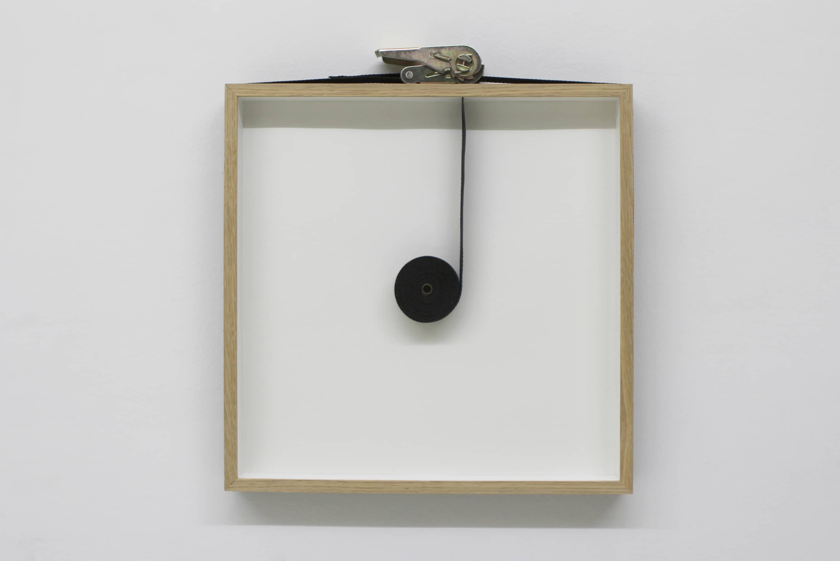 PIERRE-ETIENNE MORELLE | Remains I (black), 2015 | glass, oak, ratchet strap, brass | cm. 45 x 42 x 4